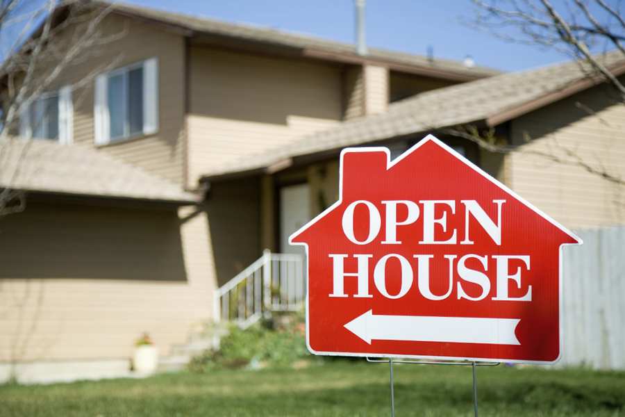 Open House sign in front of a house